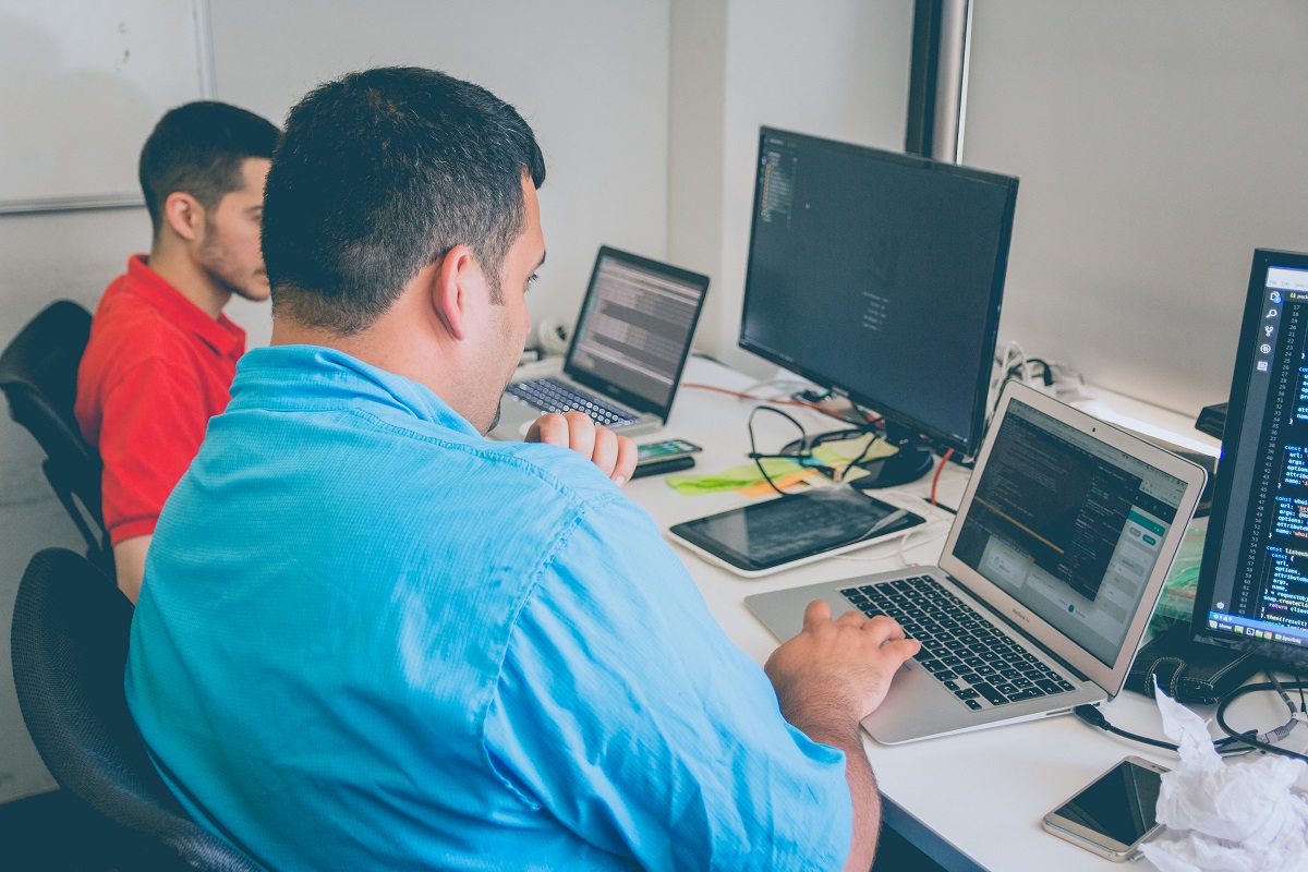 People working and having a discussion about the online cloud