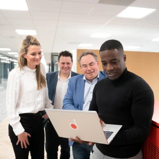 4 people having a meeting
